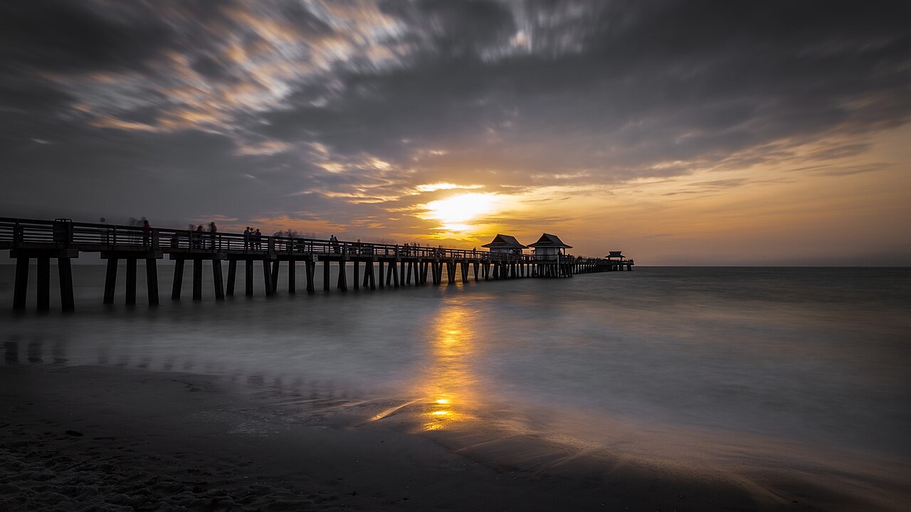 Naples Pier at sunset, an archival view of the Naples coastline